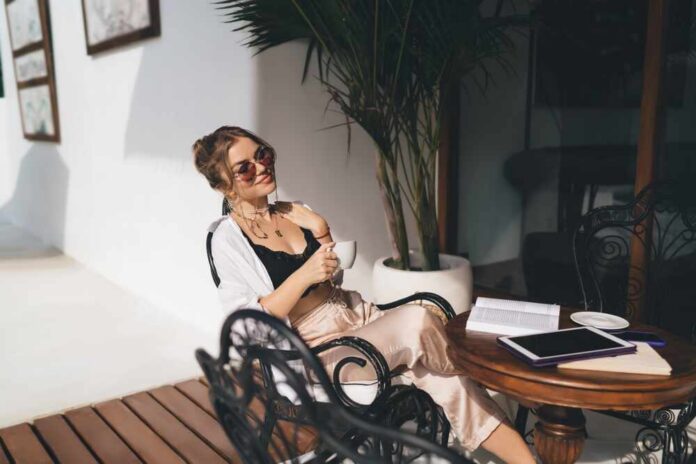 Freelancer,Woman,Holding,Coffee,,Gazing,Sideways,With,Soft,Smile.,Captures