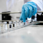 The Anti-Heart Attack Vaccine A healthcare professional in a lab preparing vaccine vials