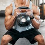 The Untold Impact of Strengthspan on Healthcare Athlete performing a kettlebell squat in a gym