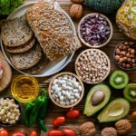 Kiwi Sleep Hack Stuns Scientists A variety of fresh foods including vegetables, fruits, grains, and proteins arranged on a wooden surface