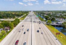 Car Emissions FAR Worse Than PFAS Aerial view of a busy highway with multiple lanes and vehicles
