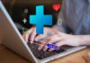 Home Tests That Reveal Your Real Lifespan Person typing on a laptop with health-related icons displayed