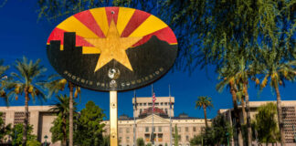 Colorful sign of the Phoenix Pride Commission in front of a government building