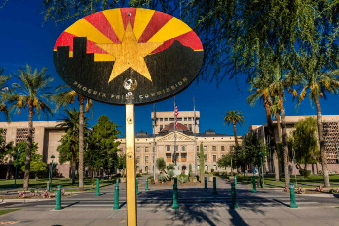 Colorful sign of the Phoenix Pride Commission in front of a government building