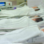 Tiny Oxygen Dips, Lifelong Brain Twist Newborn infants resting in hospital cribs in a nursery