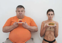Perfection Diets Quietly Wreck Health? A man holding an apple and a woman holding a hamburger, showcasing contrasting food choices