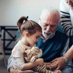 Constantly Trying To “Understand’ Your Child May Have An Unintended Consequence Child with stuffed tiger sitting with elderly couple