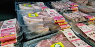 Various packaged pork products displayed in a grocery store