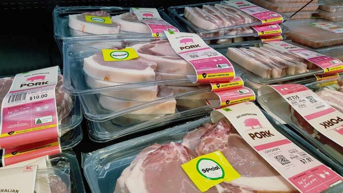shutterstock_1994278604 Various packaged pork products displayed in a grocery store