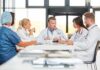 Doctors in a meeting at a hospital conference table