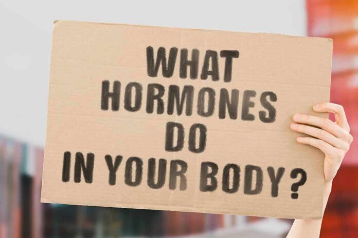 Hands holding a cardboard sign with a health-related question