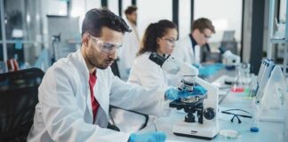 Scientist using a microscope in a modern laboratory