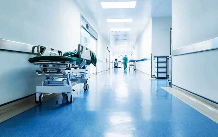 Hospital hallway with empty gurney
